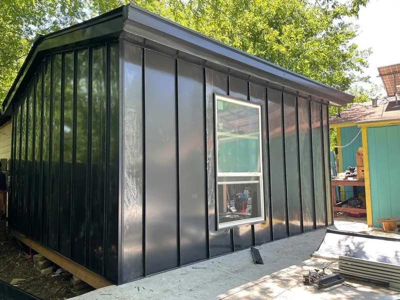 Black standing seam metal wall panels for Roof Inspection in Venersborg